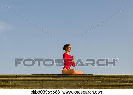 "Young woman practising Hatha yoga, outdoors, showing the pose Padmasana, Lotus pose" View Large Photo Image Stock Photo - "Young woman practising Hatha yoga, outdoors, showing the pose Padmasana, Lotus pose". Fotosearch