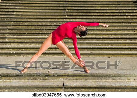 "Young woman practising Hatha-Yoga outdoors, here the pose trikonasana, triangle" View Large Photo Image Stock Photography - "Young woman practising Hatha-Yoga outdoors, here the pose trikonasana, triangle". Fotosearch