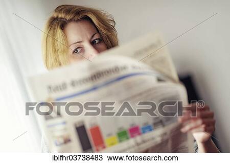 "Young woman reading a newspaper with the prognosis of the German federal election, Germany, Europe" View Large Photo Image Stock Image - "Young woman reading a newspaper with the prognosis of the German federal election, Germany, Europe". Fotosearch