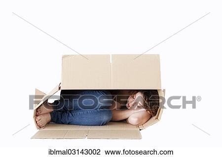 Young woman sleeping in a removal box View Large Photo Image Stock Image - Young woman sleeping in a removal box. Fotosearch