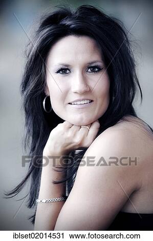 Stock Image - "Young woman smiling, portrait". Fotosearch