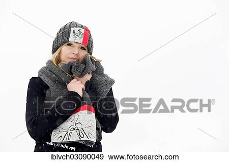 "Young woman snuggling up in her shawl, Alpbach, Tyrol, Austria, Europe" View Large Photo Image Stock Photo - "Young woman snuggling up in her shawl, Alpbach, Tyrol, Austria, Europe". Fotosearch