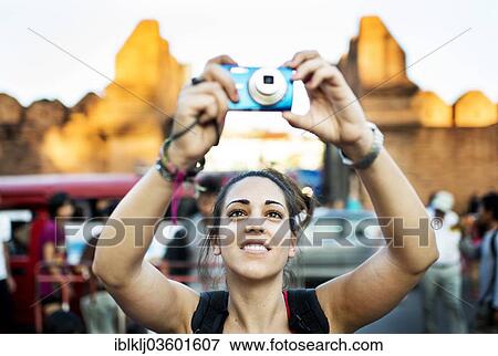 "Young woman taking pictures at a street market, Chiang Mai, Chiang Mai Province, Thailand, Asia" View Large Photo Image Stock Photo - "Young woman taking pictures at a street market, Chiang Mai, Chiang Mai Province, Thailand, Asia". Fotosearch
