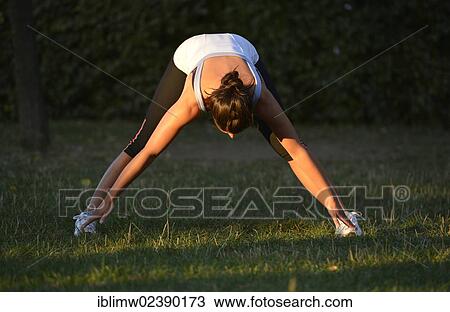 "Young woman warming up, stretching exercises, Stuttgart, Baden-Wuerttemberg, Germany, Europe, PublicGround, Europe" View Large Photo Image Stock Image - "Young woman warming up, stretching exercises, Stuttgart, Baden-Wuerttemberg, Germany, Europe, PublicGround, Europe". Fotosearch