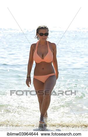 "Young woman wearing a bikini coming out of the sea, Playa de Papagayo or Papagayo beach, Lanzarote, Canary Islands, Spain, Europe" View Large Photo Image Picture - "Young woman wearing a bikini coming out of the sea, Playa de Papagayo or Papagayo beach, Lanzarote, Canary Islands, Spain, Europe". Fotosearch