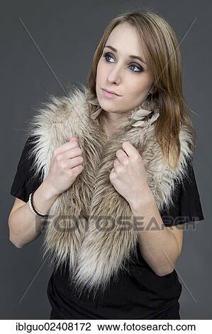 Young woman wearing a fake fur scarf View Large Photo Image Stock Image - Young woman wearing a fake fur scarf. Fotosearch