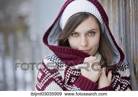 "Young woman wearing a knitted sweater with a hood, portrait, Germany, Europe" View Large Photo Image Stock Photo - "Young woman wearing a knitted sweater with a hood, portrait, Germany, Europe". Fotosearch