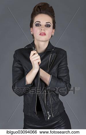 Stock Photograph - "Young woman wearing a leather outfit, fashion". Fotosearch
