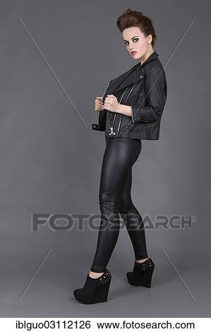 "Young woman wearing a leather outfit, fashion" View Large Photo Image Stock Photograph - "Young woman wearing a leather outfit, fashion". Fotosearch