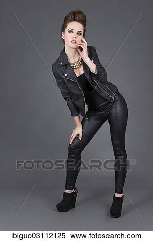 Stock Photography - "Young woman wearing a leather outfit, fashion". Fotosearch