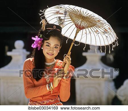 "Young woman wearing a traditional silk robe, with a paper umbrella, Mandalay, Mandalay Division, Myanmar, Burma, Asia" View Large Photo Image Stock Photo - "Young woman wearing a traditional silk robe, with a paper umbrella, Mandalay, Mandalay Division, Myanmar, Burma, Asia". Fotosearch