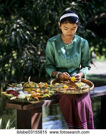 "Young woman wearing a traditional costume with carved exotic fruits, Rose Garden, Thailand, Asia" View Large Photo Image Stock Photography - "Young woman wearing a traditional costume with carved exotic fruits, Rose Garden, Thailand, Asia". Fotosearch