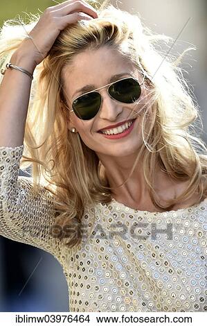 Picture - "Young woman wearing sunglasses, smiling, Stuttgart, Baden-Wurttemberg, Germany, Europe". Fotosearch