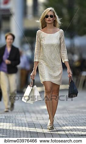 "Young woman wearing sunglasses, shopping in a pedestrian zone, Stuttgart, Baden-Wurttemberg, Germany, Europe" View Large Photo Image Stock Photograph - "Young woman wearing sunglasses, shopping in a pedestrian zone, Stuttgart, Baden-Wurttemberg, Germany, Europe". Fotosearch