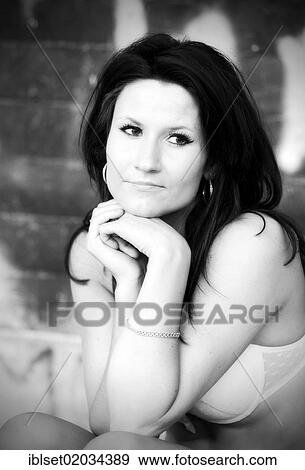 "Young woman wearing underwear, with her chin supported on her hands" View Large Photo Image Stock Photo - "Young woman wearing underwear, with her chin supported on her hands". Fotosearch