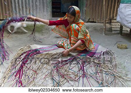 "Young woman weaving raffia in front of a tin-sheet home, Barakandi, Sirajganj, Bangladesh, South Asia, Asia" View Large Photo Image Stock Image - "Young woman weaving raffia in front of a tin-sheet home, Barakandi, Sirajganj, Bangladesh, South Asia, Asia". Fotosearch