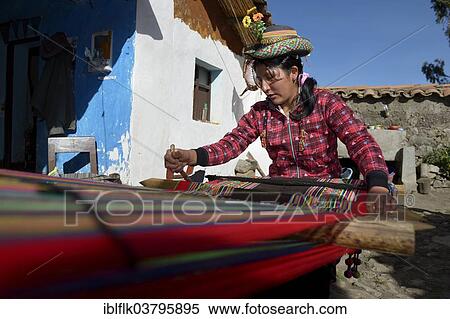 Stock Photography - "Young woman weaving traditional cloth at the loom, Quispillacta, Ayacucho, Peru, South America". Fotosearch