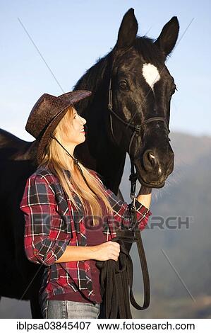 "Young woman with a black Hanoverian horse, North Tyrol, Austria, Europe" View Large Photo Image Stock Photo - "Young woman with a black Hanoverian horse, North Tyrol, Austria, Europe". Fotosearch
