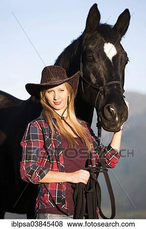 "Young woman with a black Hanoverian horse, North Tyrol, Austria, Europe" View Large Photo Image Stock Photo - "Young woman with a black Hanoverian horse, North Tyrol, Austria, Europe". Fotosearch