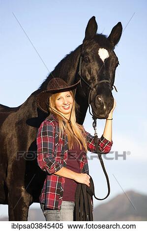 "Young woman with a black Hanoverian horse, North Tyrol, Austria, Europe" View Large Photo Image Stock Photography - "Young woman with a black Hanoverian horse, North Tyrol, Austria, Europe". Fotosearch