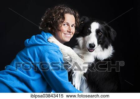 "Young woman with a Border Collie, black and white" View Large Photo Image Stock Photography - "Young woman with a Border Collie, black and white". Fotosearch