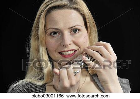 "Young woman with a harmonica, Schwabisch Gmund, Ostalbkreis, Baden-Wurttemberg, Germany, Europe" View Large Photo Image Stock Photograph - "Young woman with a harmonica, Schwabisch Gmund, Ostalbkreis, Baden-Wurttemberg, Germany, Europe". Fotosearch