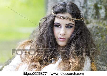 "Young woman with a headband, portrait" View Large Photo Image Picture - "Young woman with a headband, portrait". Fotosearch