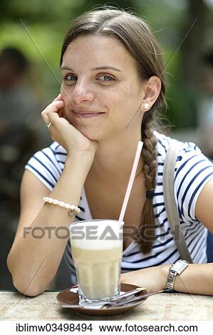 "Young woman with a latte macchiato, Heidelberg, Baden-Wurttemberg, Germany, Europe" View Large Photo Image Picture - "Young woman with a latte macchiato, Heidelberg, Baden-Wurttemberg, Germany, Europe". Fotosearch