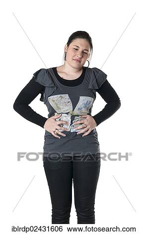 Stock Photograph - "Young woman with abdominal pain, stomach pain". Fotosearch