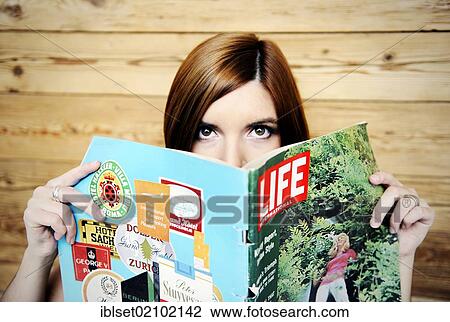 Young woman with an old Life magazine View Large Photo Image Stock Image - Young woman with an old Life magazine. Fotosearch