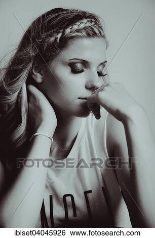 Stock Photograph - Young woman with braided hair. Fotosearch