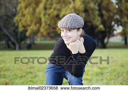 Young woman with cap View Large Photo Image Stock Photo - Young woman with cap. Fotosearch