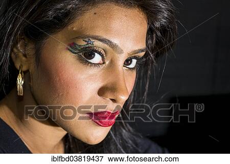 Stock Photo - "Young woman with fancy eye make-up, portrait, Mumbai, Maharashtra, India, Asia". Fotosearch