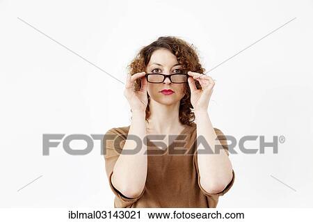 Young woman with glasses View Large Photo Image Stock Image - Young woman with glasses. Fotosearch