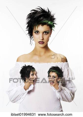 Stock Image - Young woman with her hands replaced with heads showing other emotions. Fotosearch
