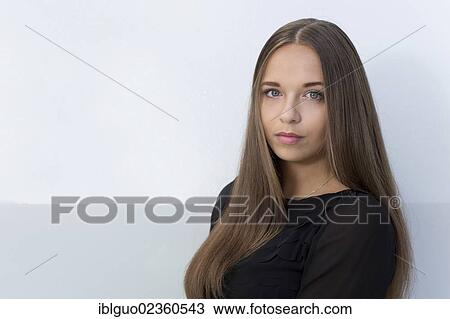 Stock Image - "Young woman with long hair, portrait". Fotosearch