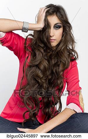 Young woman with long hair wearing a red jacket and jeans View Large Photo Image Stock Photo - Young woman with long hair wearing a red jacket and jeans. Fotosearch