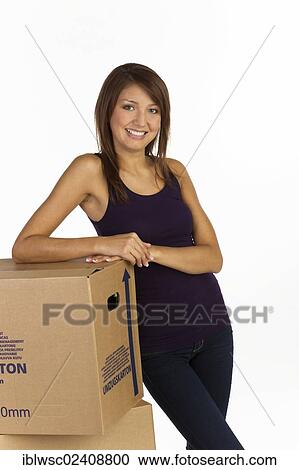 Young woman with moving boxes View Large Photo Image Stock Image - Young woman with moving boxes. Fotosearch