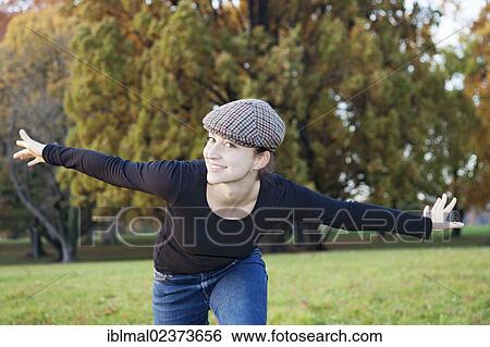 Young woman with outstretched arms View Large Photo Image Stock Photograph - Young woman with outstretched arms. Fotosearch