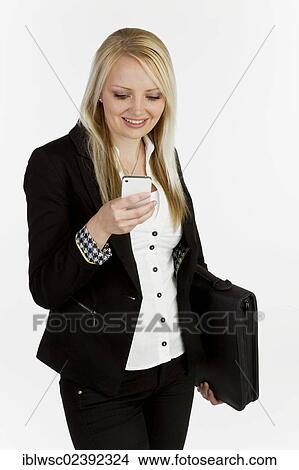 Young woman with smartphone and briefcase View Large Photo Image Picture - Young woman with smartphone and briefcase. Fotosearch