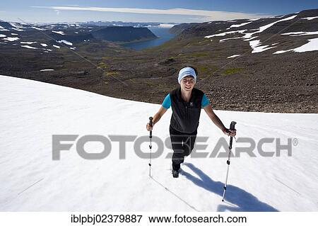 "Young woman with walking poles, Hornstrandir, Western Iceland, Iceland, Europe" View Large Photo Image Stock Photo - "Young woman with walking poles, Hornstrandir, Western Iceland, Iceland, Europe". Fotosearch
