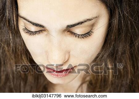 Stock Photograph - Young woman's face. Fotosearch
