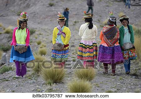 "Young women carrying heavy stones to secure the shores of an artificial lake for irrigation, Quispillacta, Ayacucho, Peru, South America" View Large Photo Image Stock Photo - "Young women carrying heavy stones to secure the shores of an artificial lake for irrigation, Quispillacta, Ayacucho, Peru, South America". Fotosearch
