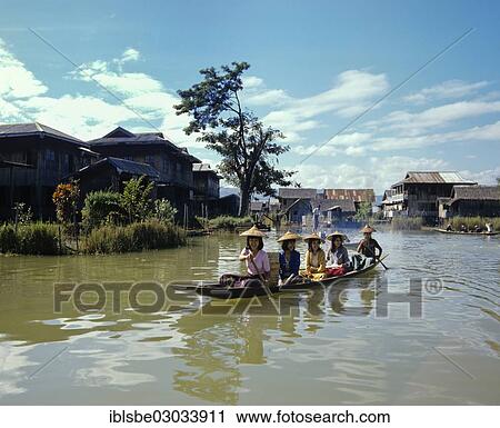 Stock Image - "Young women in a boat on Inle Lake, Inle See, Shan State, Myanmar, Burma, Asia". Fotosearch