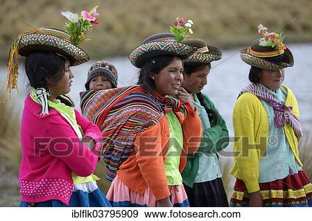 "Young women in colorful, traditional costumes and baby in a sling, Quispillacta, Ayacucho, Peru, South America" View Large Photo Image Stock Photo - "Young women in colorful, traditional costumes and baby in a sling, Quispillacta, Ayacucho, Peru, South America". Fotosearch