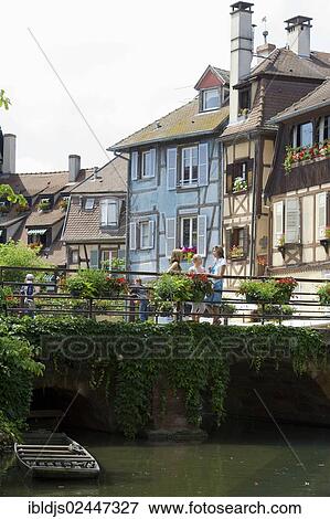 "Young women standing on a bridge in Petite Venise, Little Venice, Colmar, Alsace, France, Europe" View Large Photo Image Stock Photo - "Young women standing on a bridge in Petite Venise, Little Venice, Colmar, Alsace, France, Europe". Fotosearch