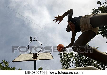 Stock Photograph - "Youth making a layup in basketball, Rio de Janeiro, Rio de Janeiro State, Brazil, South America". Fotosearch