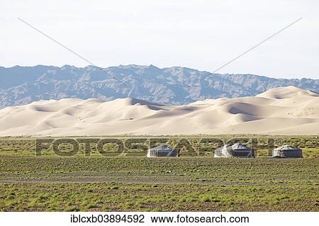 "Yurts or Gers, on the green steppe in front of the large sand dunes of Khongoryn Els, Gobi Gurvansaikhan National Park, Gobi Desert, Southern Desert, Omnogovi Province, Mongolia, Asia" View Large Photo Image Stock Image - "Yurts or Gers, on the green steppe in front of the large sand dunes of Khongoryn Els, Gobi Gurvansaikhan National Park, Gobi Desert, Southern Desert, Omnogovi Province, Mongolia, Asia". Fotosearch