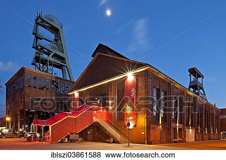 Stock Photo - "Zeche Ewald colliery with the Revuepalast Ruhr at dusk, Herten, Ruhrgebiet region, North Rhine-Westphalia, Germany, Europe". Fotosearch