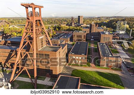 "Zeche Zollverein, former coal mine, UNESCO World Heritage Site, Ehrenhof courtyard and the Red Dot Design Museum, double headframe, Shaft 12, Essen, North Rhine-Westphalia, Germany, Europe" View Large Photo Image Stock Image - "Zeche Zollverein, former coal mine, UNESCO World Heritage Site, Ehrenhof courtyard and the Red Dot Design Museum, double headframe, Shaft 12, Essen, North Rhine-Westphalia, Germany, Europe". Fotosearch